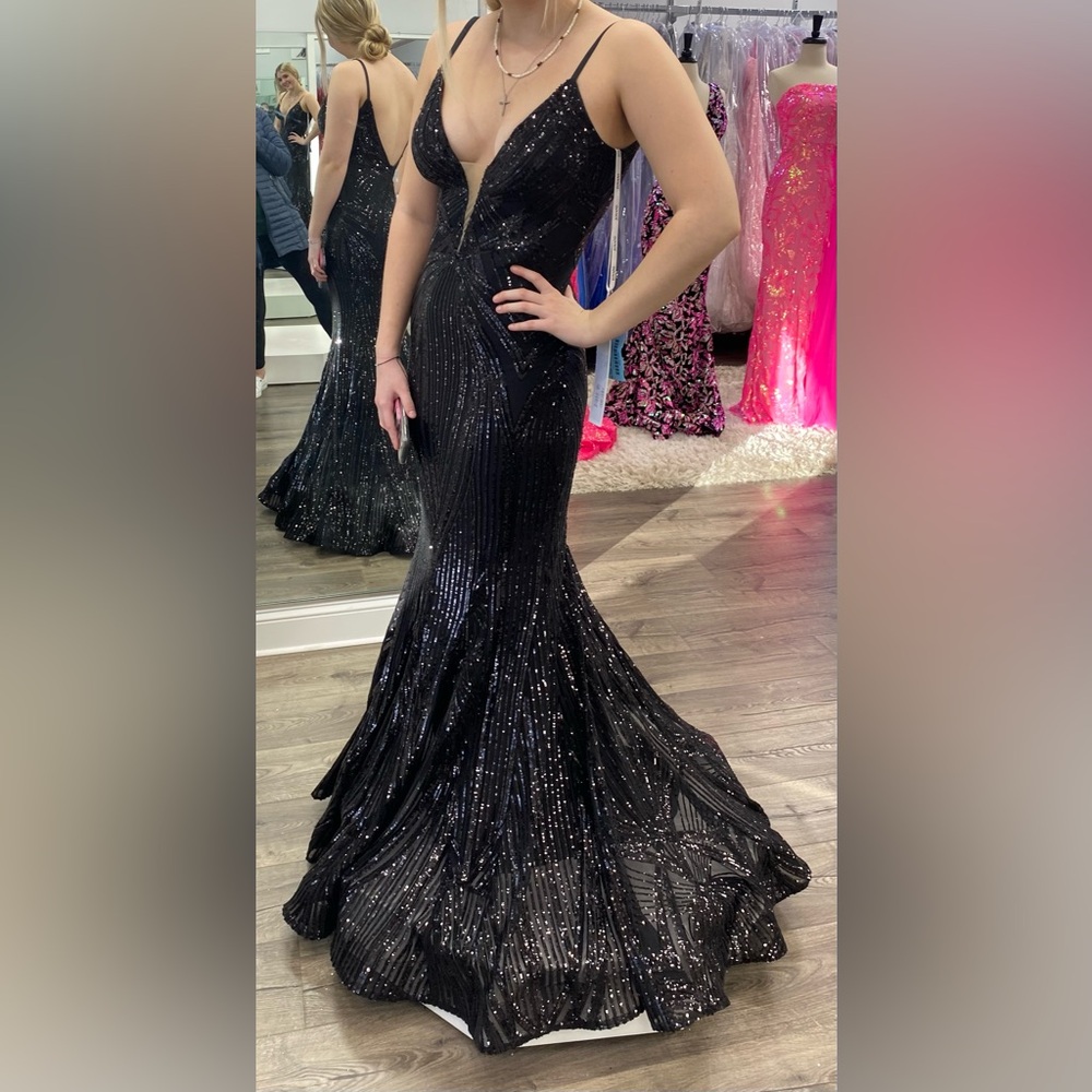 Black Jovani Dress
Seller is 5'4", 130lbs, 32D bust size.